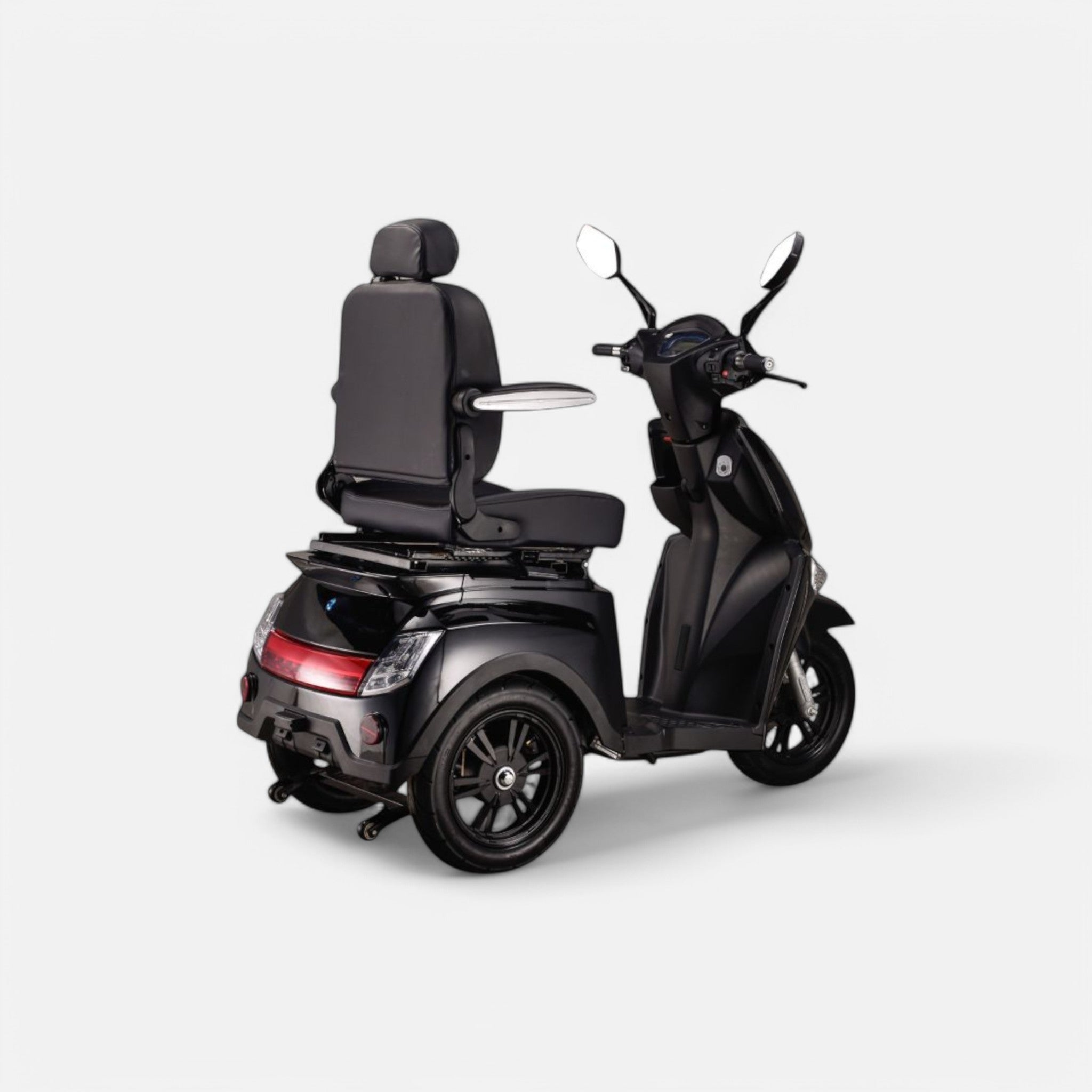 GoVida IVA Z1000 Zwart scootmobiel parked on a sidewalk, showcasing its sleek black design and comfortable seating.